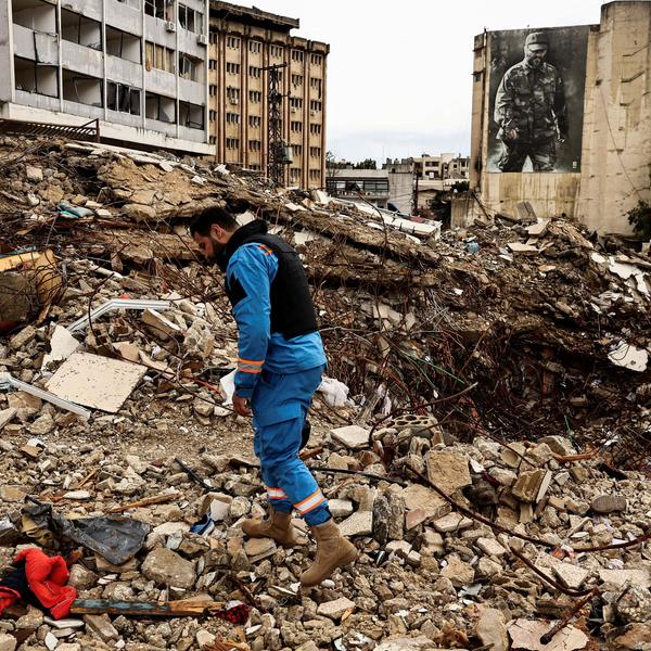 A paramedic walks among the rubble at a site damaged in an Israeli strike, amid escalating hostilities between Israel and Hezbollah, as the U.S.-Israeli conflict with Iran continues, in Nabatieh, Lebanon, March 25, 2026. REUTERS/Yara Nardi