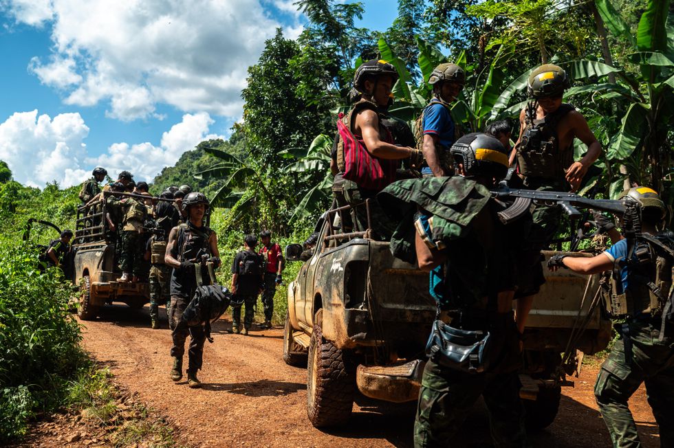 A platoon from Alpha Team 01, affiliated with the National Unity Government, returns to its base
