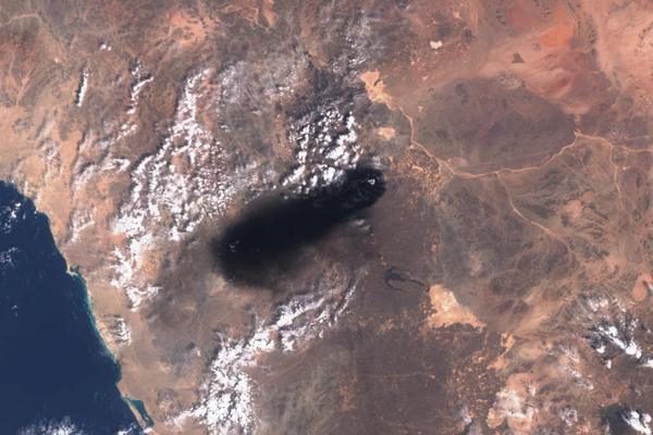 Black smoke rises from Saudi Arabia's East-West oil pipeline south of Medina, Hejaz Region, after strikes allegedly carried out by an Iraqi militia