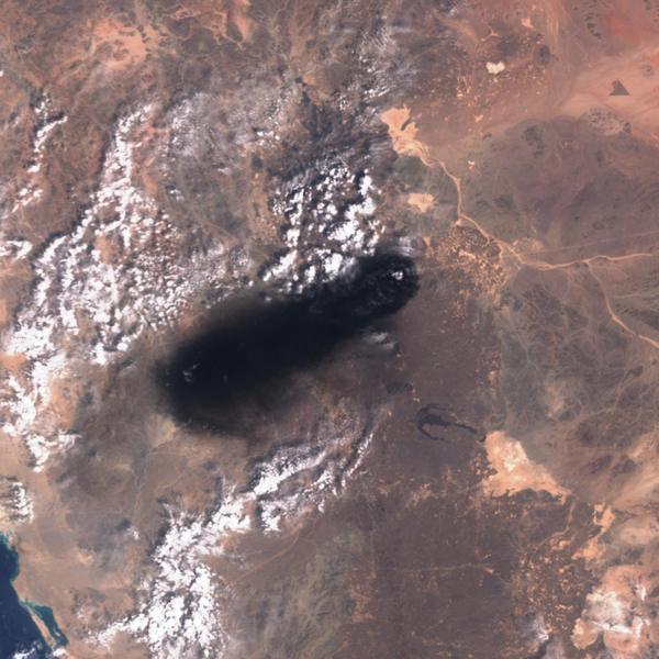Black smoke rises from Saudi Arabia's East-West oil pipeline south of Medina, Hejaz Region, after strikes allegedly carried out by an Iraqi militia