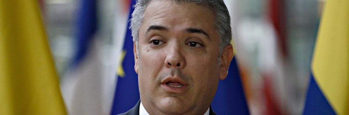 A warm Washington welcome for Colombia's controversial ex-president