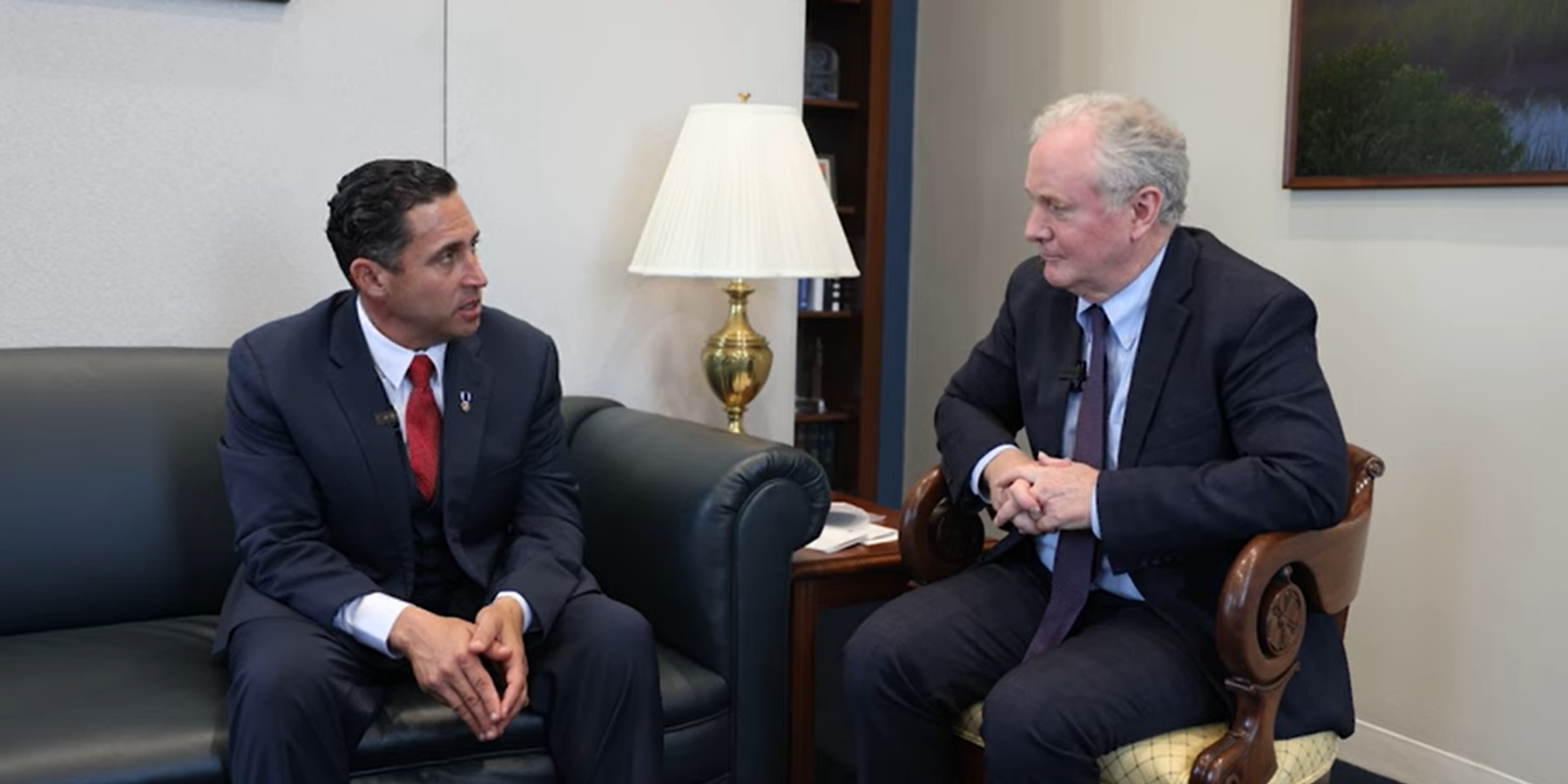Former GHF contractor Anthony Aguilar and Sen. Chris Van Hollen (D.-Md)