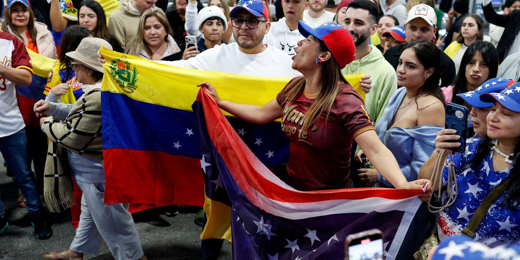 Regime change faithful toss roses at Trump after Maduro overthrow