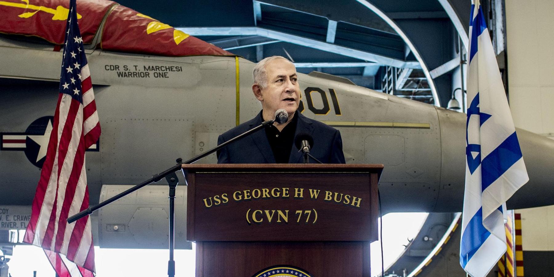 Israeli Prime Minister Benjamin Netanyahu speaks during a visit to an American aircraft carrier