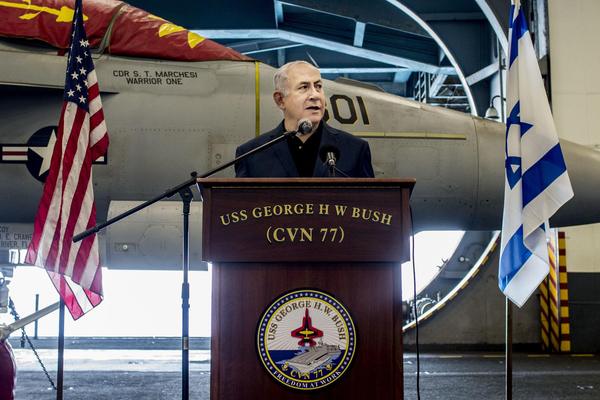 Israeli Prime Minister Benjamin Netanyahu speaks during a visit to an American aircraft carrier