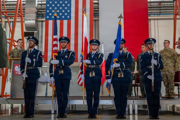 Members of the Ramstein Air Base honor guard post the colors during the 52d Operations Group Detachment 1 change of command ceremony at the 32d Tactical Air Base