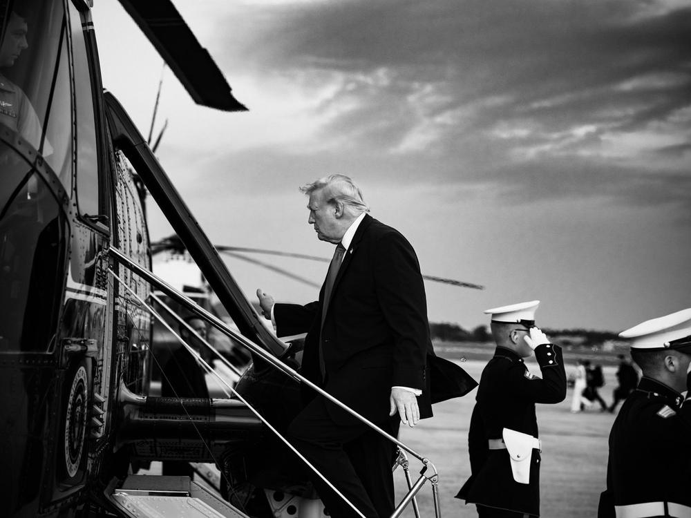 President Donal Trump boards a helicopter