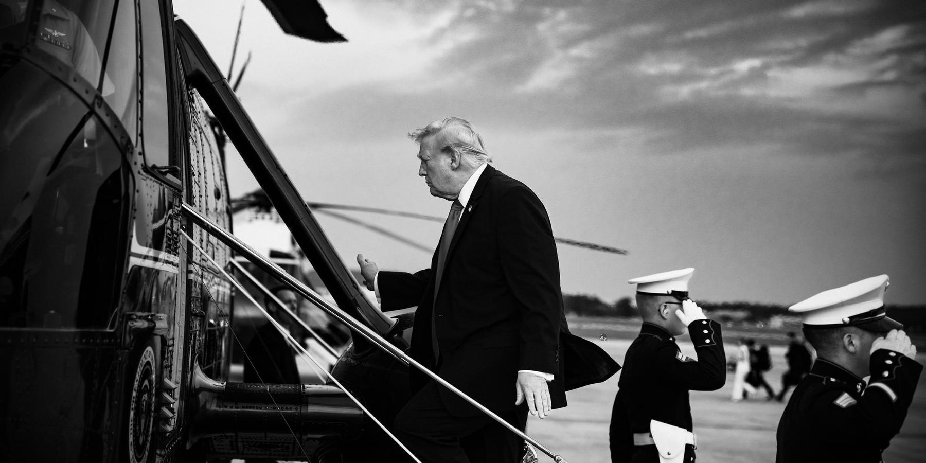President Donal Trump boards a helicopter