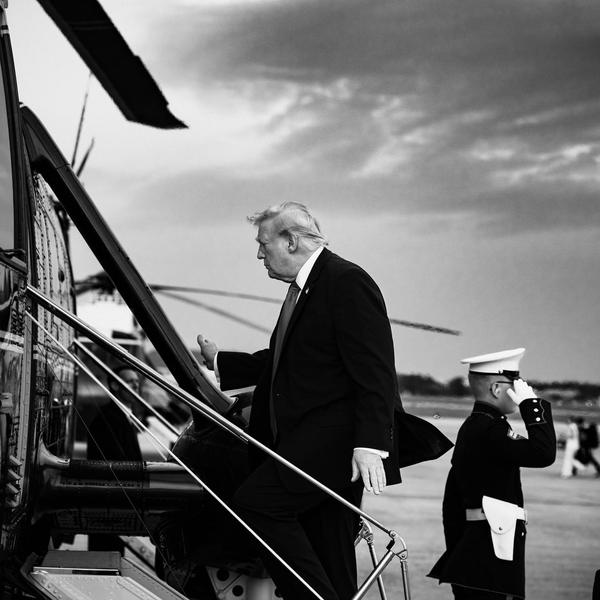 President Donal Trump boards a helicopter