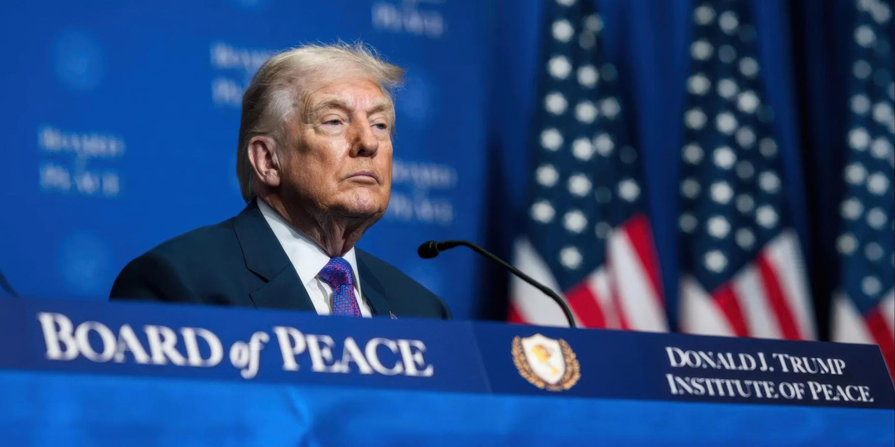 President Donald Trump sits on stage at the inaugural meeting of the Board of Peace in February 2026.