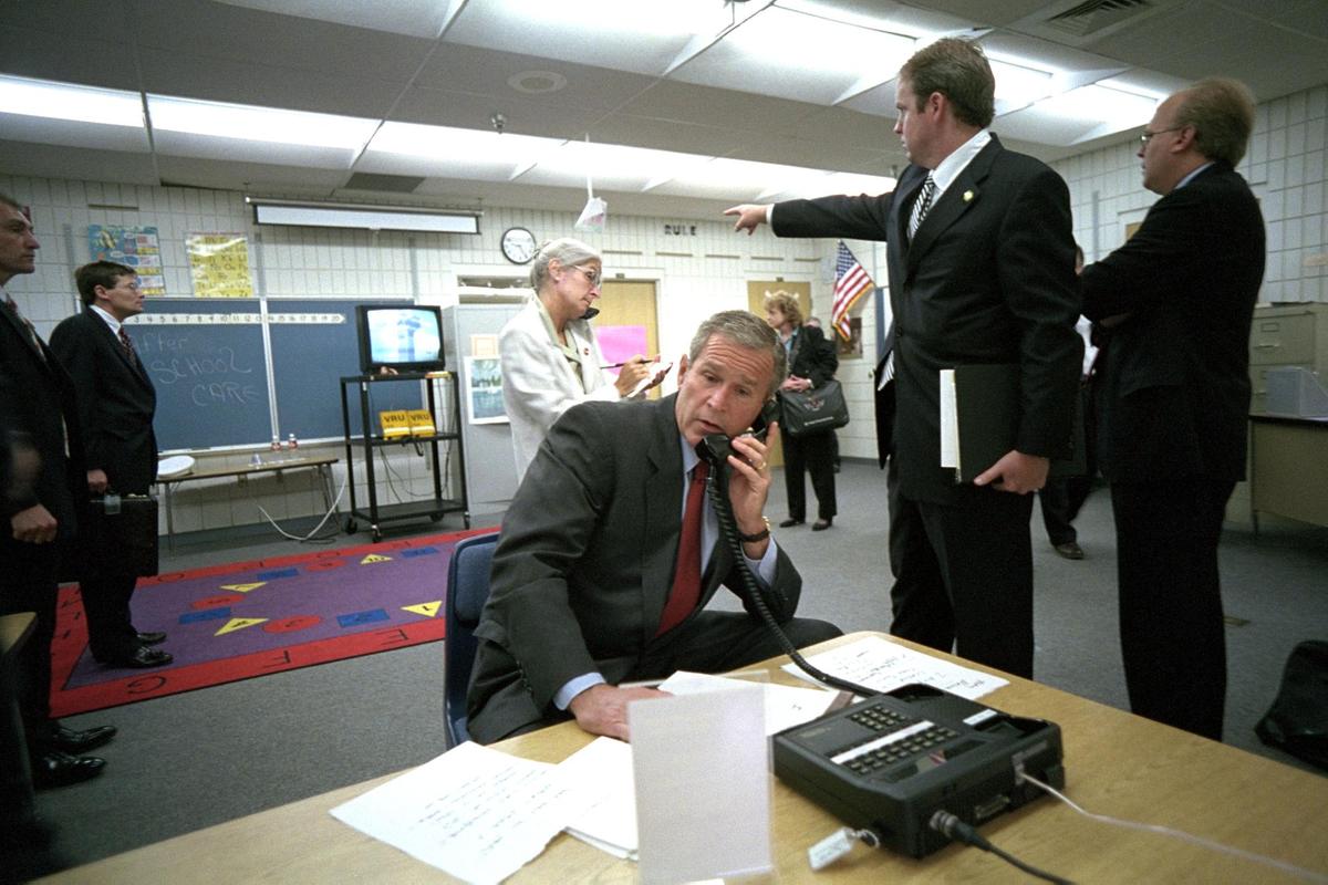 President George W. Bush and White House staff watch news coverage of Flight 175 striking the South Tower of the World Trade Center at Emma E. Booker Elementary School in Sarasota, Florida