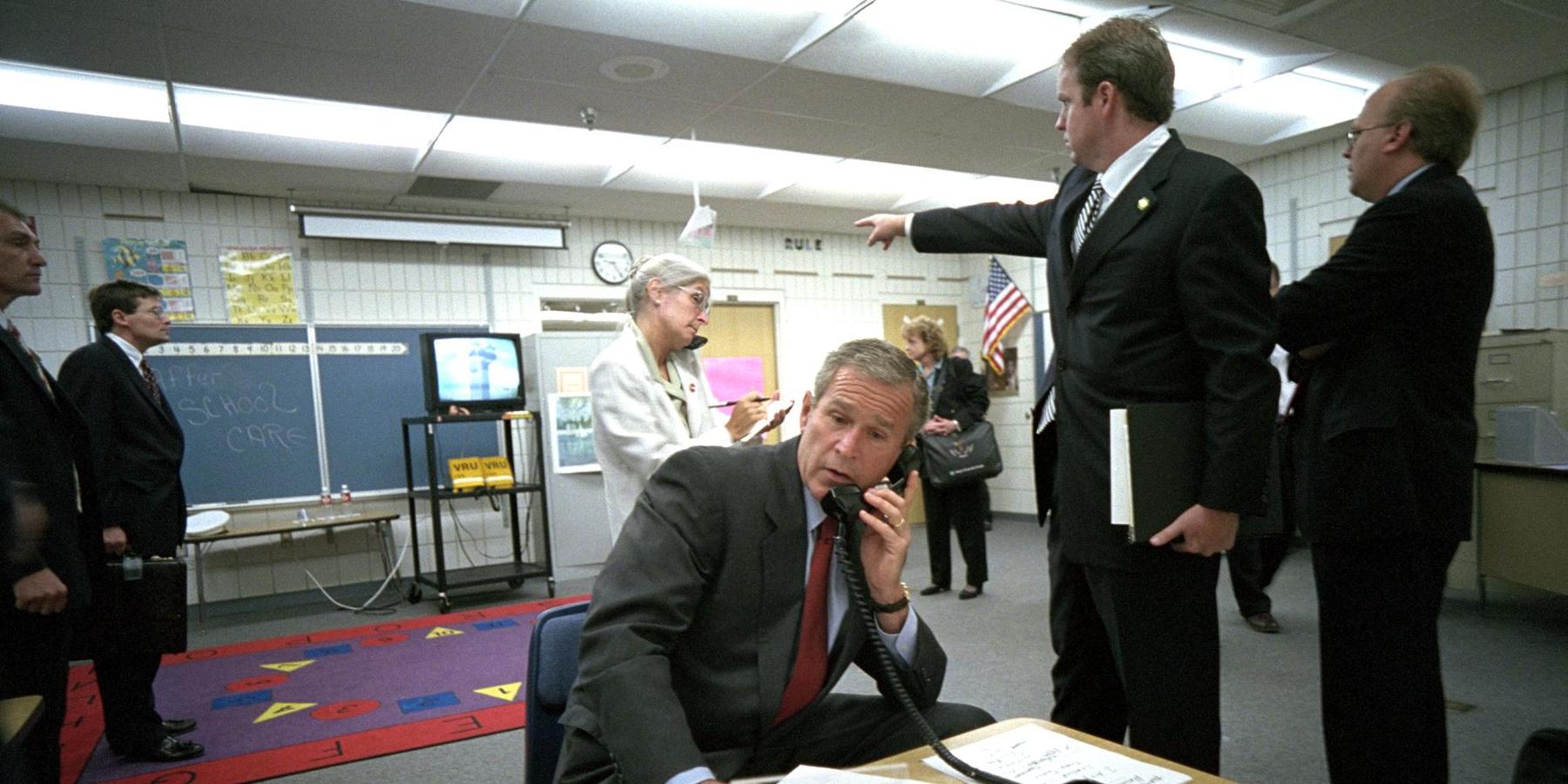 President George W. Bush and White House staff watch news coverage of Flight 175 striking the South Tower of the World Trade Center at Emma E. Booker Elementary School in Sarasota, Florida