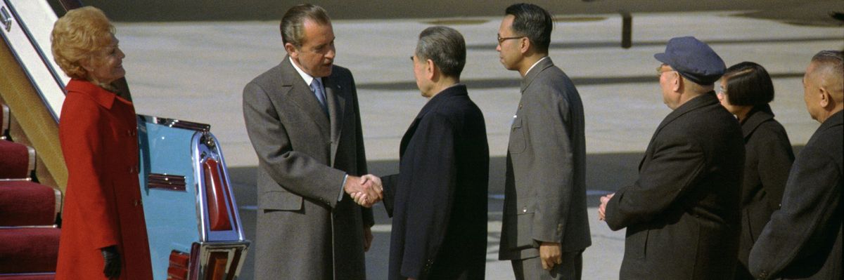 President_richard_nixon_and_premier_chou_en-lai_shake_hands_at_the_nixons_arrival_in_peking_china-scaled