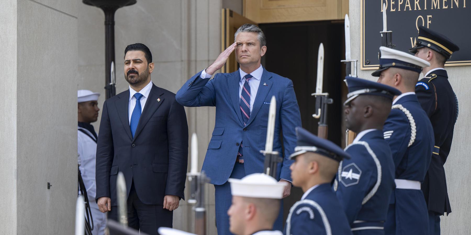 Secretary of Defense Pete Hegseth and Iraqi Prime Minister Ali al-Zaidi stand for the playing of the U.S. and Iraqi national anthems prior to a bilateral meeting at the Pentagon