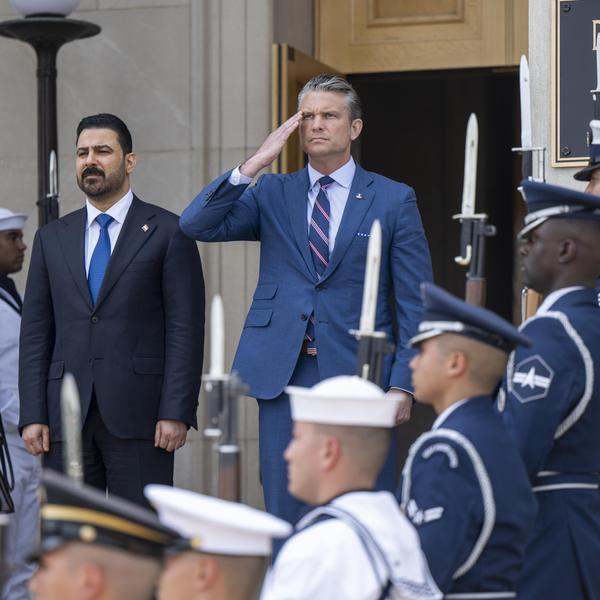 Secretary of Defense Pete Hegseth and Iraqi Prime Minister Ali al-Zaidi stand for the playing of the U.S. and Iraqi national anthems prior to a bilateral meeting at the Pentagon