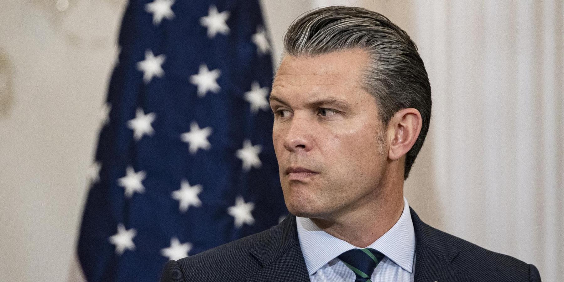 Secretary of Defense Pete Hegseth answering questions from journalists during a press conference at the Pentagon