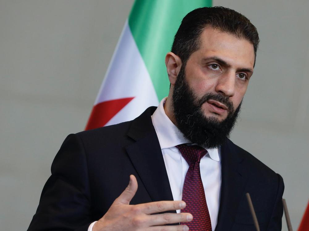 Syrian interim president, Ahmed al-Sharaa, speaks after a meeting with the German chancellor at the Federal Chancellery in Berlin, German
