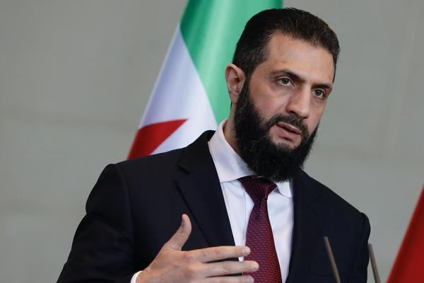 Syrian interim president, Ahmed al-Sharaa, speaks after a meeting with the German chancellor at the Federal Chancellery in Berlin, German