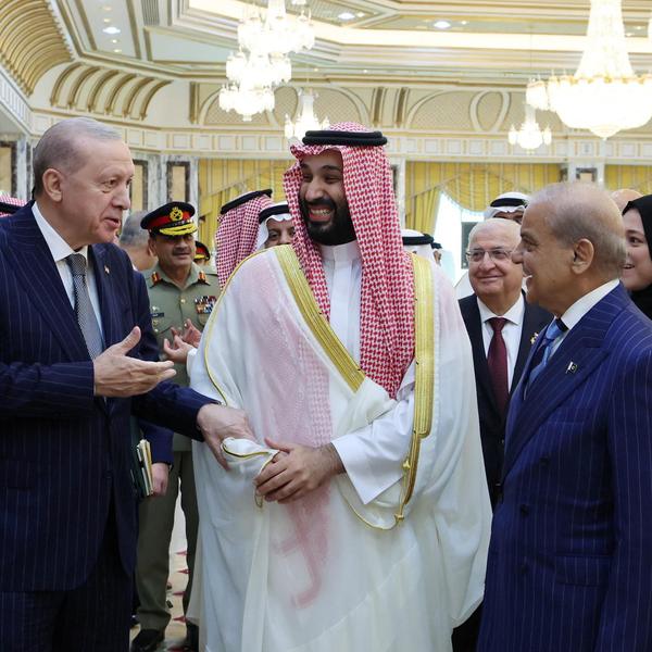 Turkish President Recep Tayyip Erdogan, Saudi Crown Prince Mohammed bin Salman and Pakistan's Prime Minister Shehbaz Sharif chat after signing a joint defense agreement in Mecca, Saudi Arabia
