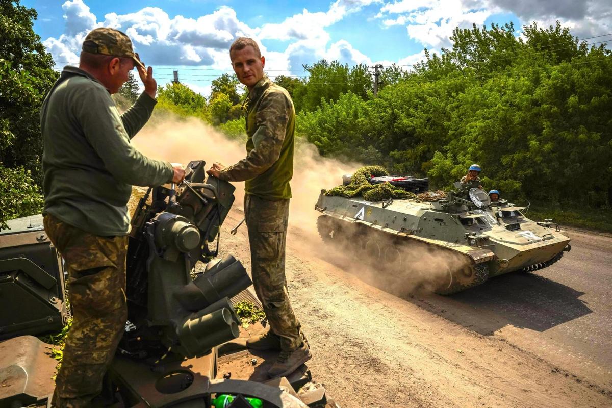 Ukrainian service members ride an Armoured Personnel Carrier, amid Russia's attack on Ukraine, near the Russian border in Sumy region, Ukraine August 11, 2024.
