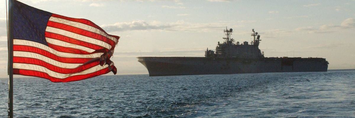Us_navy_060411-n-1786n-020_the_american_flag_flies_high_as_the_utility_landing_craft_lcu-1635_travels_to_unload_excess_ammunition_off_of_the_amphibious_assault_ship_uss_tarawa_lha_1