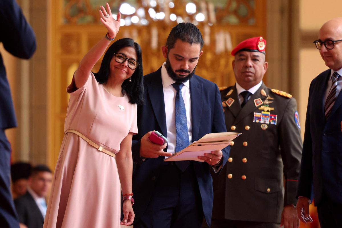 Venezuela's acting President Delcy Rodriguez waves ahead of a meeting with Paraguayan President Santiago Pena at Miraflores Palace